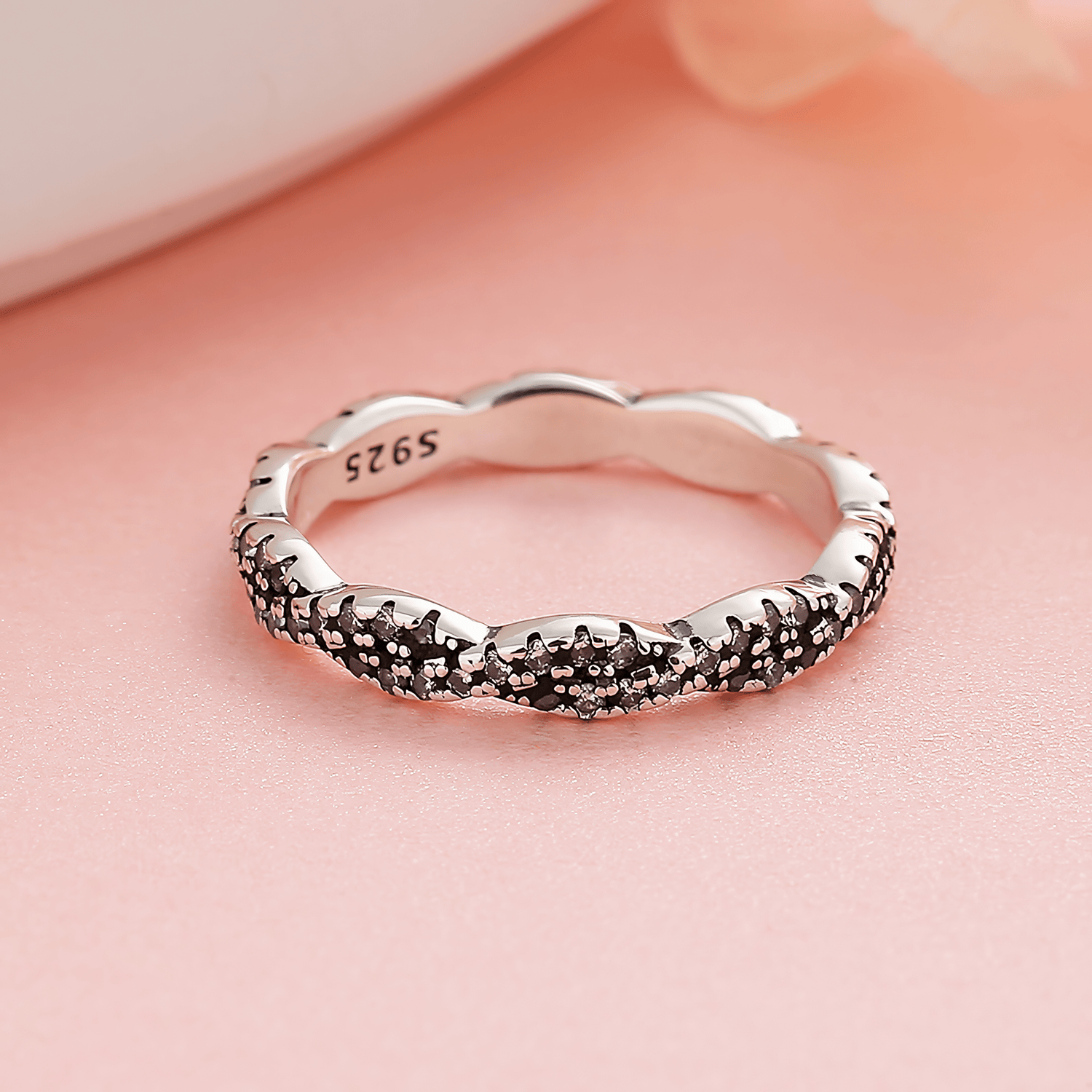 Twilight Twist – Sterling Silver Eternity Ring with Interwoven Black & White CZ Stones - NAFALUXE