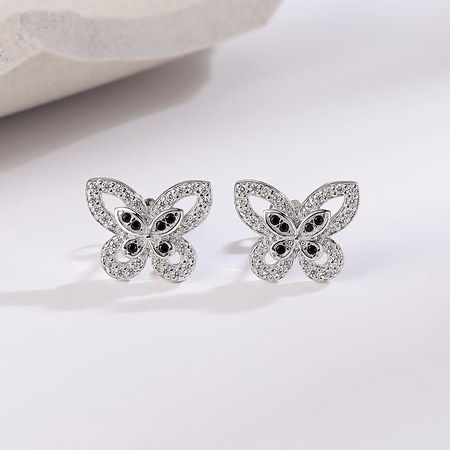 Elegant Butterfly Stud Earrings – 925 Sterling Silver with Black & White CZ - NAFALUXE