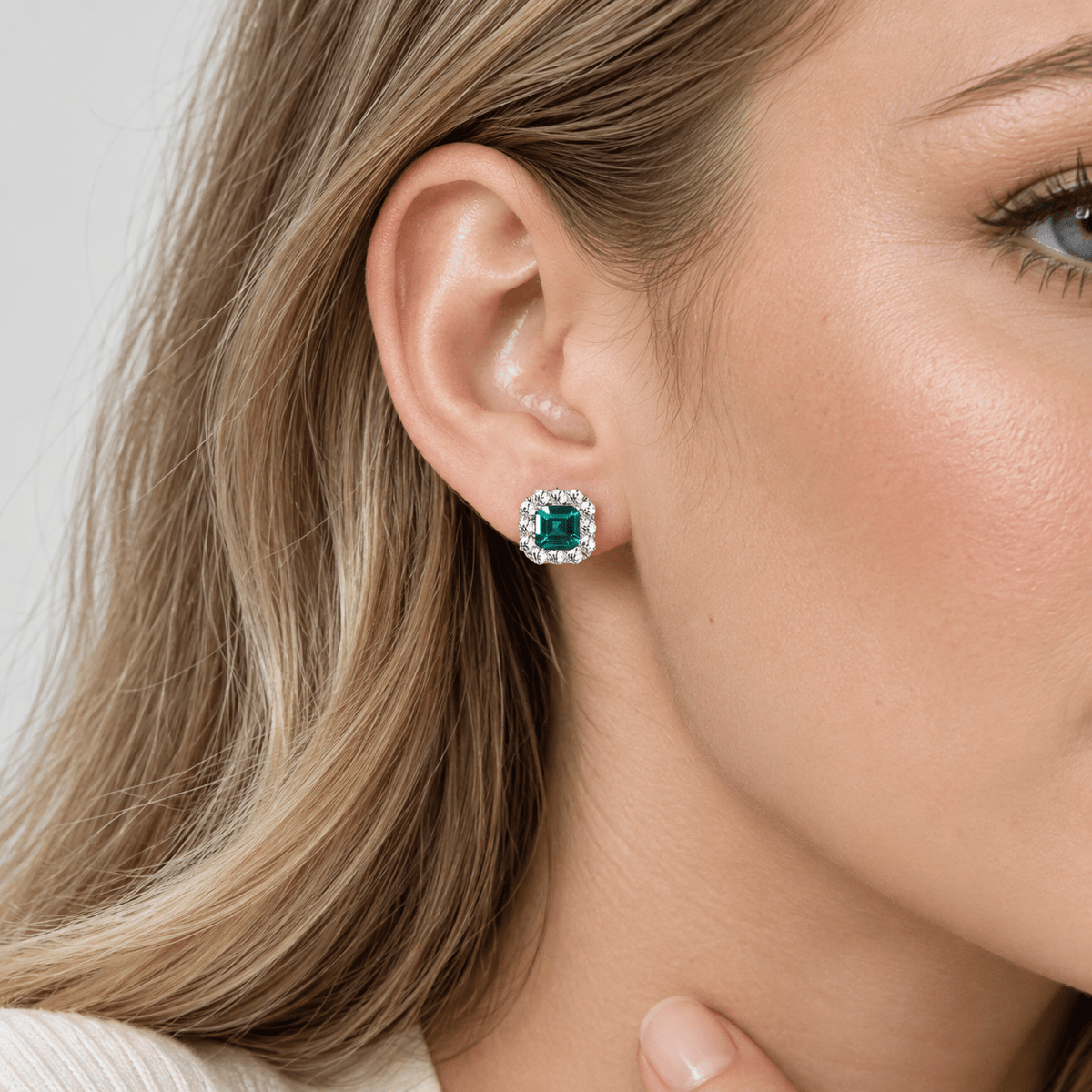 Elegant Emerald-Cut Aqua Blue CZ Halo Stud Earrings in Sterling Silver - NAFALUXE