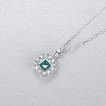 Elegant Emerald - Cut Green CZ Halo Pendant Necklace in Sterling Silver - NAFALUXE