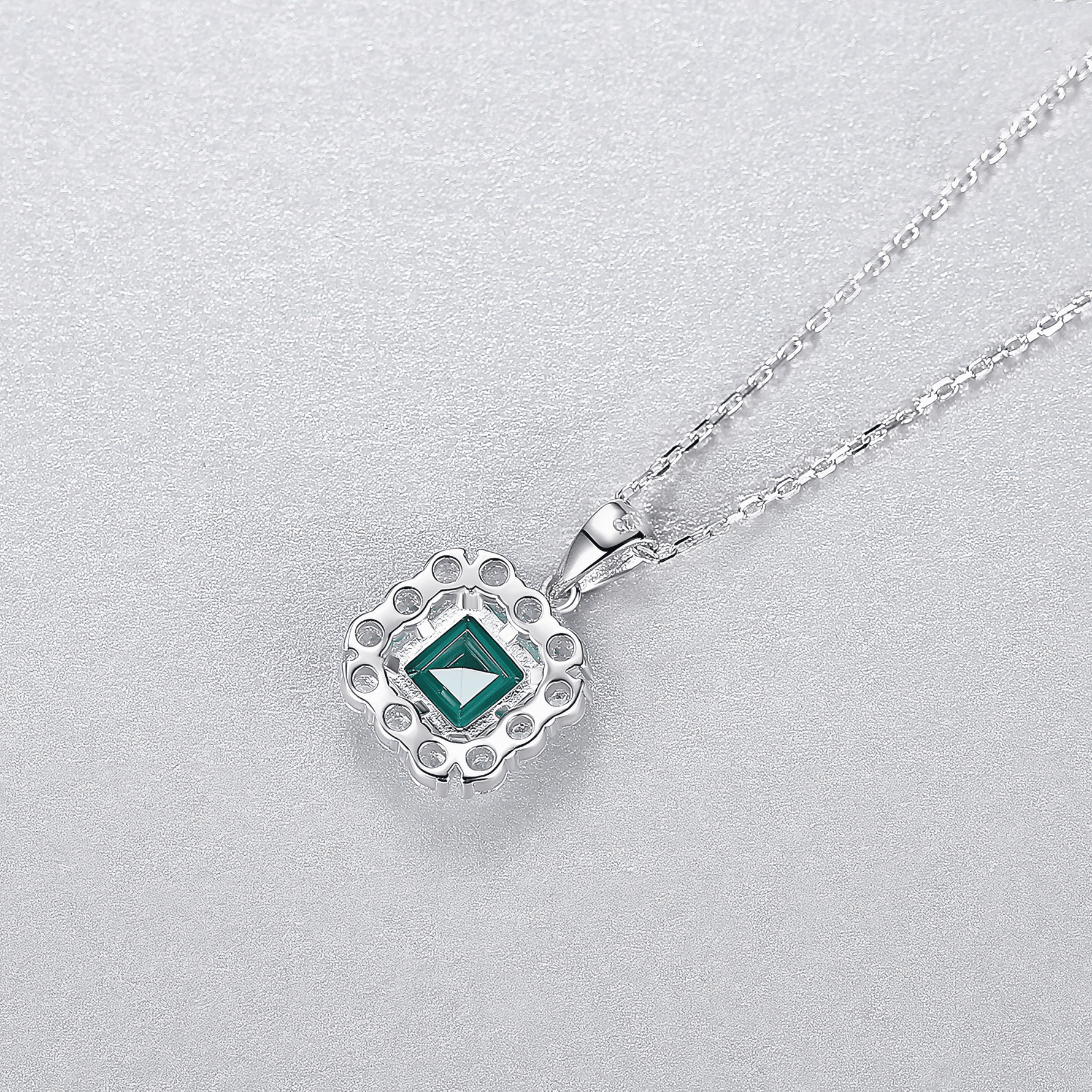 Elegant Emerald - Cut Green CZ Halo Pendant Necklace in Sterling Silver - NAFALUXE