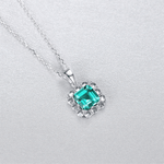 Elegant Emerald - Cut Green CZ Halo Pendant Necklace in Sterling Silver - NAFALUXE