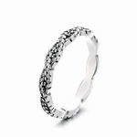 Twilight Twist – Sterling Silver Eternity Ring with Interwoven Black & White CZ Stones - NAFALUXE