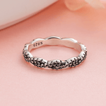 Twilight Twist – Sterling Silver Eternity Ring with Interwoven Black & White CZ Stones - NAFALUXE
